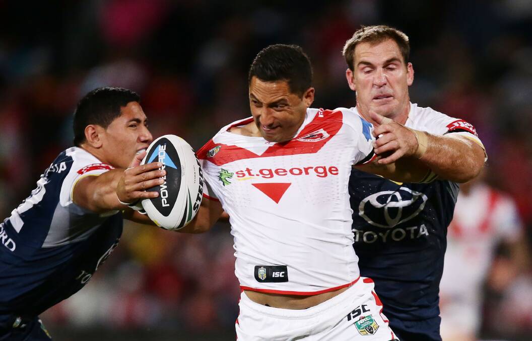 Benji Marshall attempts to shrug off two Cowboys defenders on Saturday. Picture: Getty Images