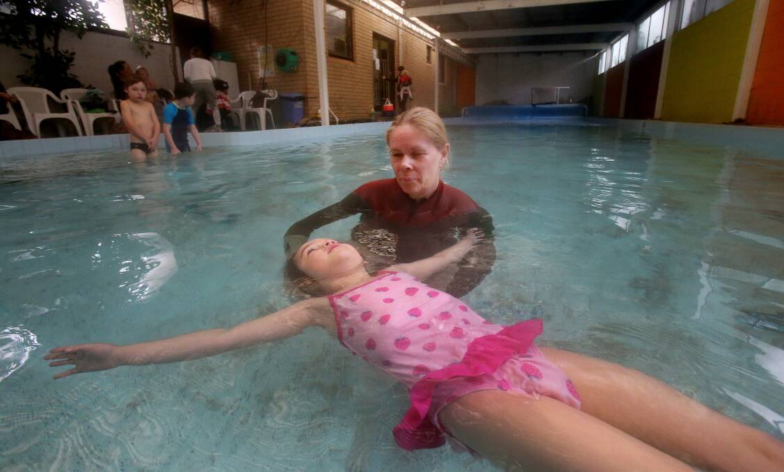 Sharon Crisafi teaches Georgia Ferri, 3, at her Wollongong swim school, which is facing closure. Picture: ROBERT PEET