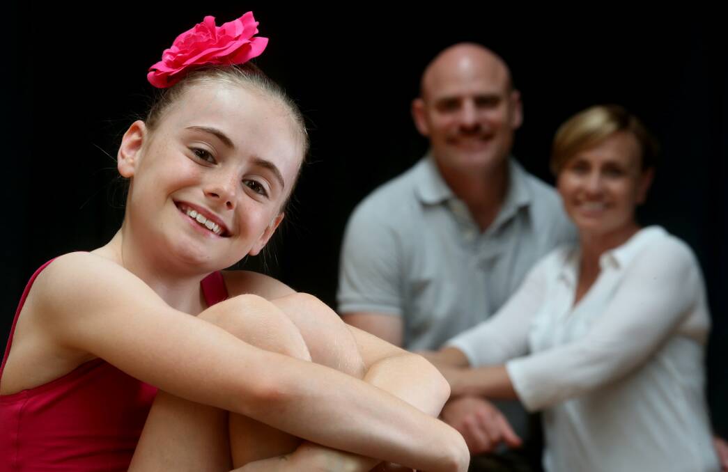 Mikayla Okely with her proud parents Tony and Mylie Okely. Picture: ROBERT PEET