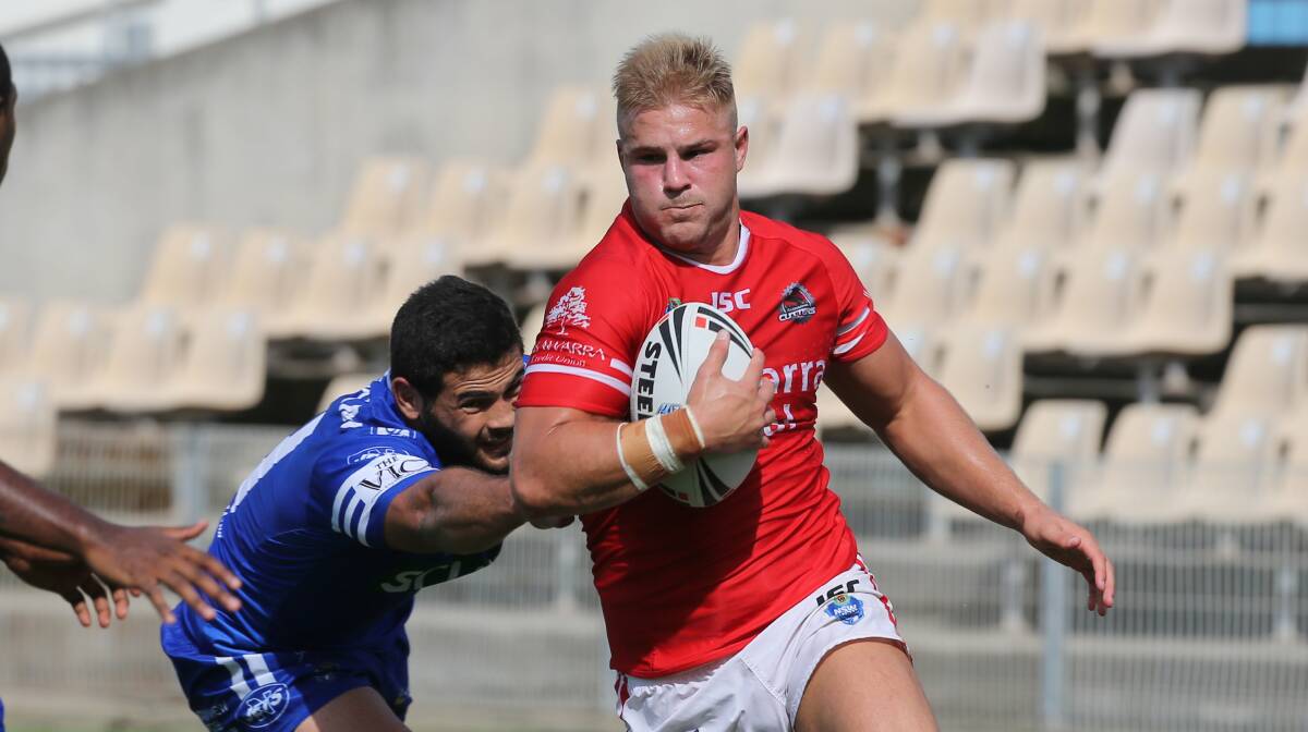 Jack de Belin charges through the Newtown Jets defensive line for the Cutters, less than 24 hours after playing for the Dragons on Friday night. Picture: ROBERT PEET