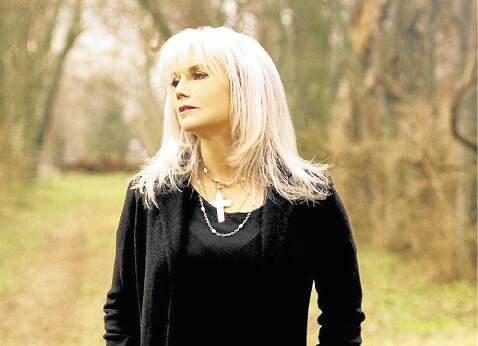 Emmylou Harris started out as a folk singer and described her crossover to country in religious terms. "I was like a convert." Picture: JACK SPENCER