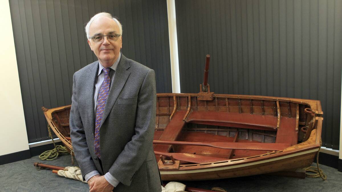  Dr Paul Brunton, former curator of the State Library of NSW, in front of a replica of Bass and Flinders’ boat Tom Thumb. Picture: ANDY ZAKELI