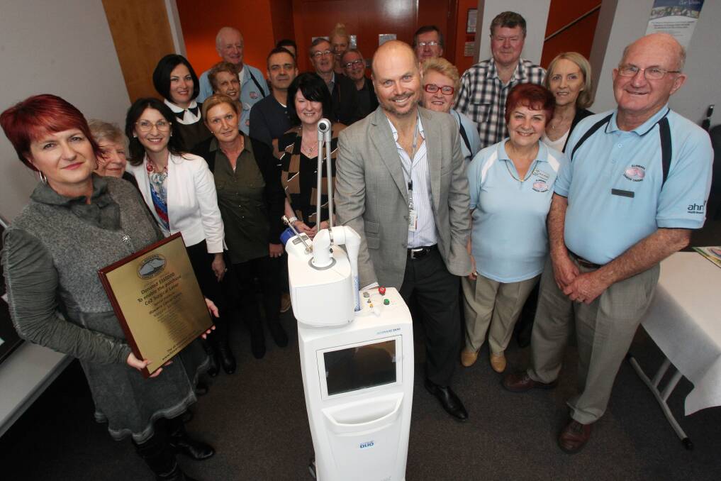 Head and neck surgeon Dr Stephen Pearson and staff with the new high-precision surgical laser at Wollongong Hospital on Tuesday. Picture: GREG TOTMAN