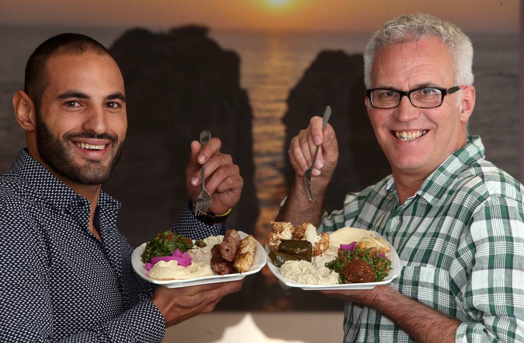 Meal mates: Restaurant owner Omar Nemer and community leader Grahame Gould are promoting tolerance through eating. Picture: Robert Peet
