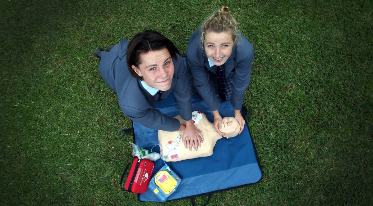 Life lesson: TIGS year 10 students Billy Fisher and Michaela McGrath practise their cardiopulmonary resuscitation (CPR) skills.Picture: KIRK GILMOUR
