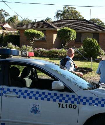 Murder charge: police at the scene. Photo: Phil Hearne