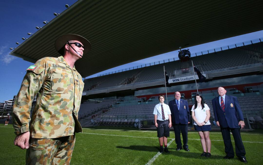 Sergeant Adam Carroll, student Jordon Smith, Peter Poulton, president of the Wollongong RSL Sub-Branch, student Madie Dowler and Major-General (retired) Horrie Howard at WIN Stadium where the Wollongong Anzac Day march will conclude with official ceremonies. Picture: KIRK GILMOUR