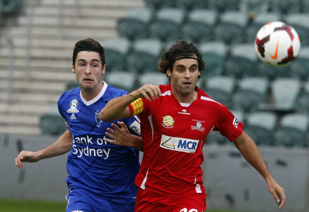 Jacob Timpano (right) shrugs off  an Olympic defender at WIN Stadium. Picture: ANDY ZAKELI