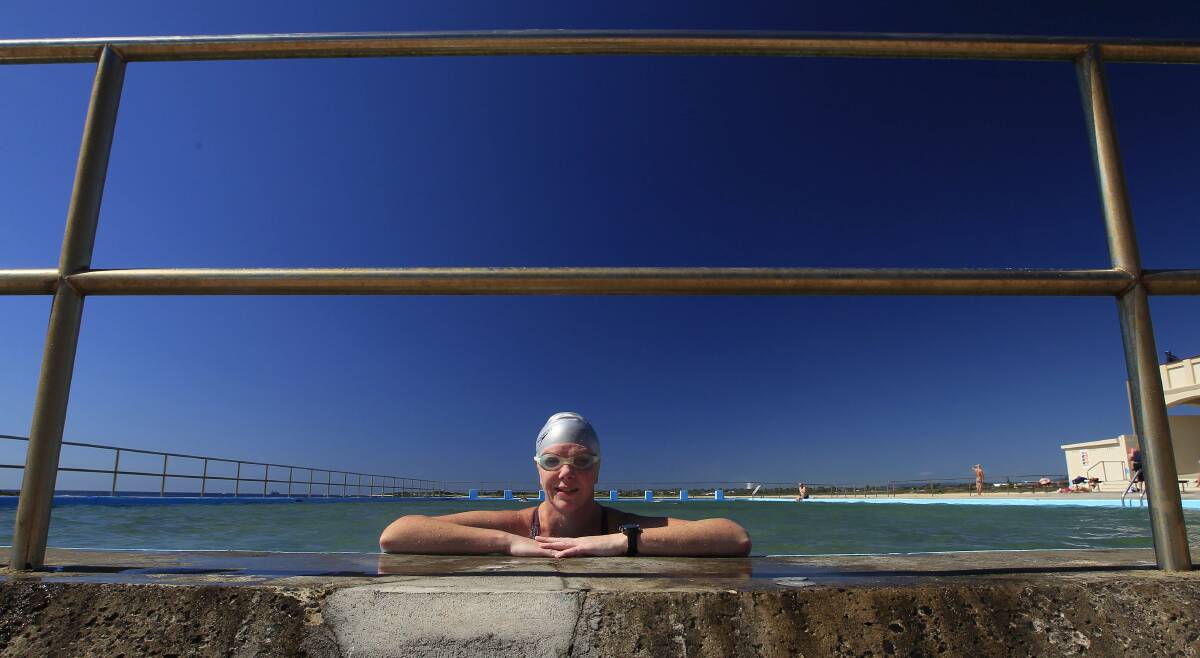Jennifer Cairns, of Quakers Hill, took advantage of Monday's sunshine to swim some laps at Woonona's ocean pool. Picture: ANDY ZAKELI