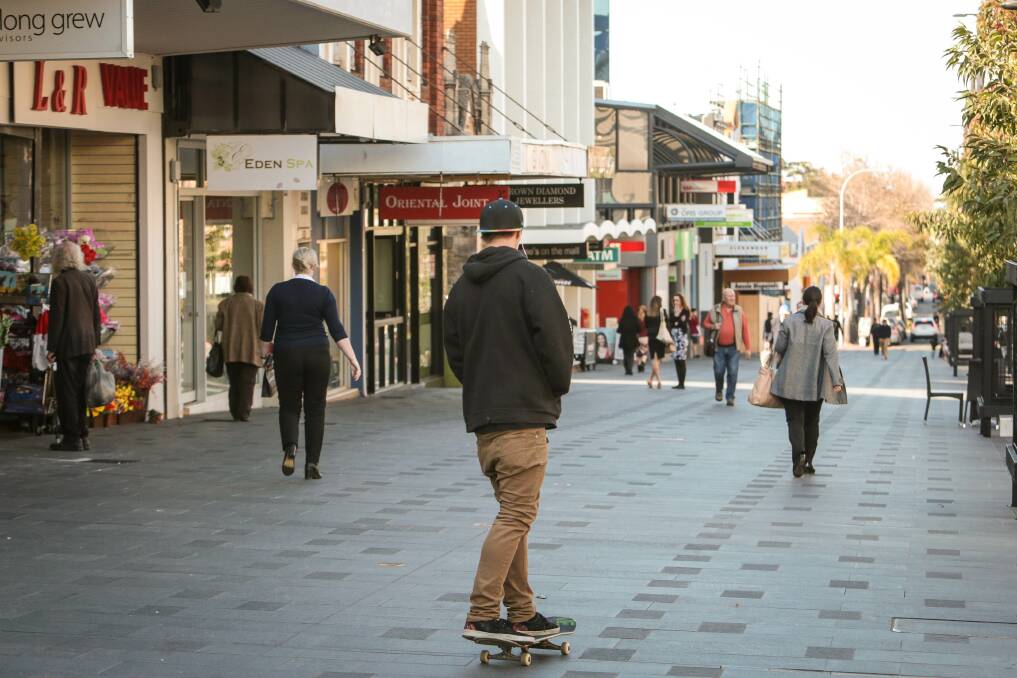 A man rides his skateboard down Crown Street Mall, which is set to be transformed for the national extreme skateboarding championships in October. Picture: ADAM McLEAN
