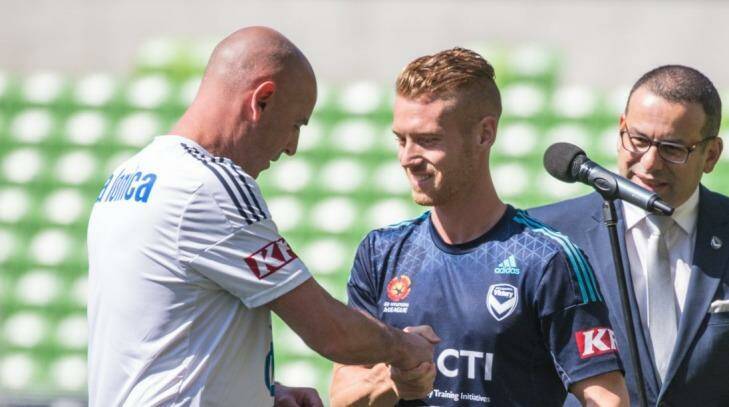 All yours: Kevin Muscat presents Oliver Bozanic with his Victory shirt. Photo: Barcroft Media
