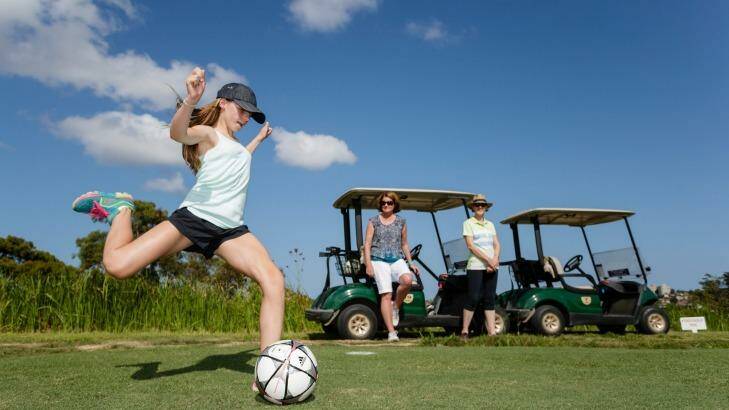 Emily Smith leans into a tee shot playing FootGolf at Northbridge Golf Club. Photo: Brook Mitchell