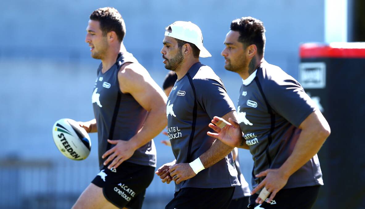 Sam Burgess, Greg Inglis and John Sutton warm up before Souths' training at Redfern Oval on Tuesday. Picture: GETTY IMAGES