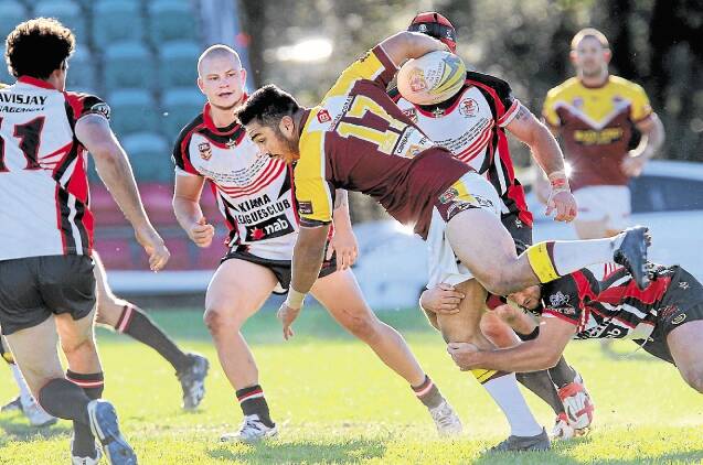 Shellharbour’s Harold Snell just fails to beat a Kiama defender on Sunday.  Picture: SYLVIA LIBER