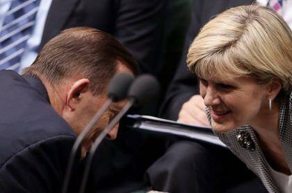 Foreign Minister Julie Bishop, talking with Prime Minister Tony Abbott, has questioned Tanya Plibersek's loyalty as Labor deputy leader.  Photo: Andrew Meares