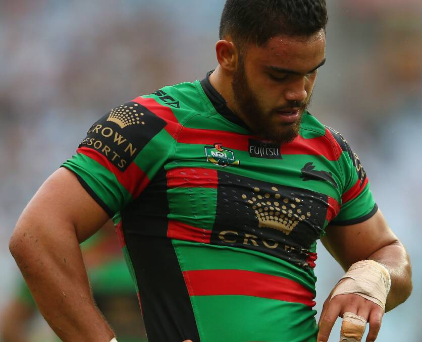 Dylan Walker of the Rabbitohs looks at his injured hand during Sunday's match. Picture: GETTY IMAGES
