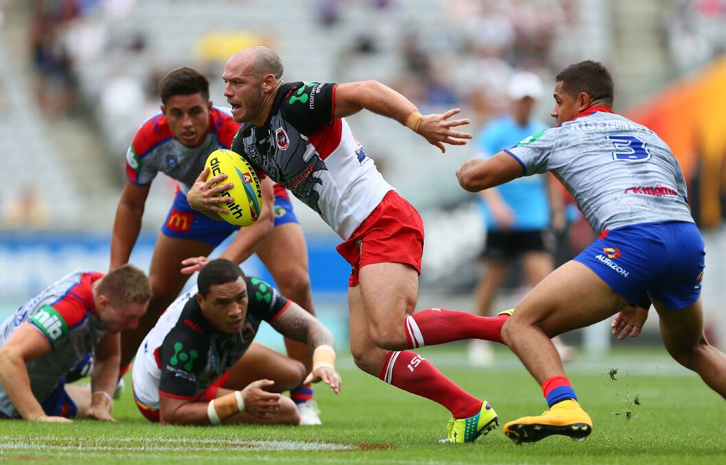 The Dragons' Heath L'Estrange makes a break during Illawarra's Auckland Nines match against Newcastle Knights. Picture: GETTY IMAGES