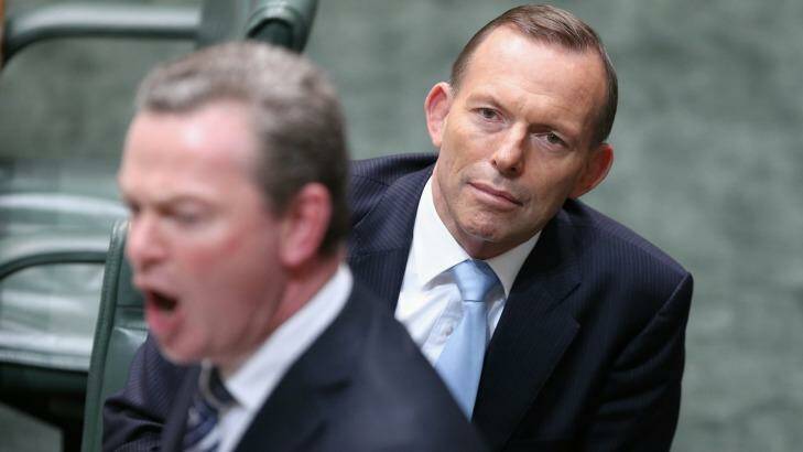Then education minister Christopher Pyne with the then prime minister Tony Abbott. Photo: Alex Ellinghausen