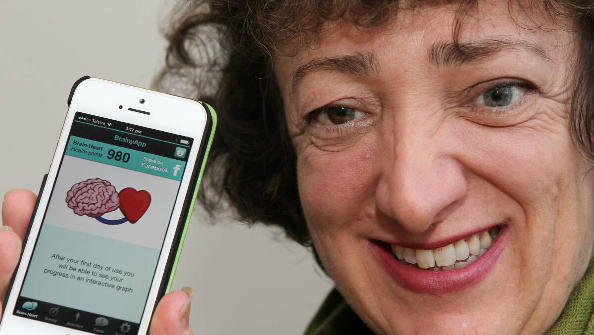 Community Options Illawarra representative Kate Troy, who has helped organise a Wollongong dementia forum, using the Brainy App. Picture: GREG TOTMAN