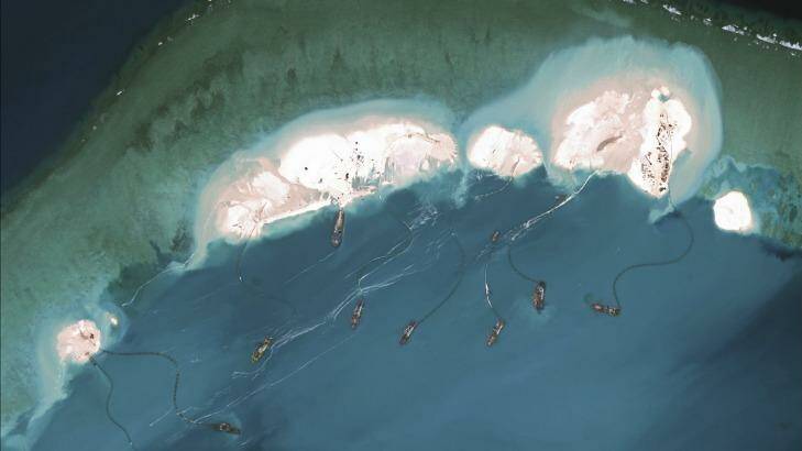 A satellite image shows dredgers working at the northernmost reclamation site of Mischief Reef, part of the Spratly Islands, in the South China Sea, last year. Photo: Supplied