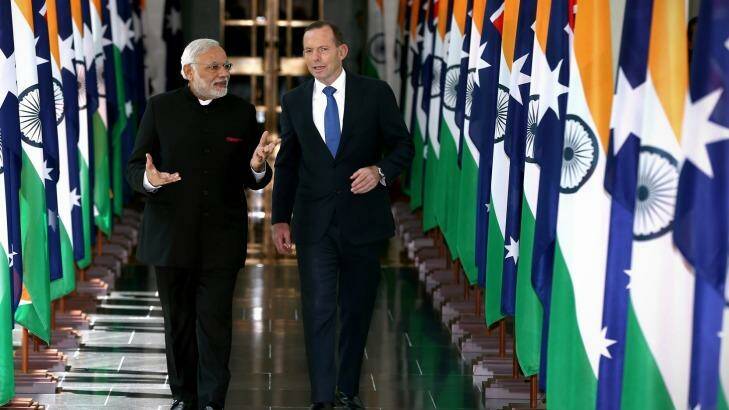 Playing the game: Indian Prime Minister Narendra Modi and Prime Minister Tony Abbott depart the House of Representatives. Photo: Alex Ellinghausen
