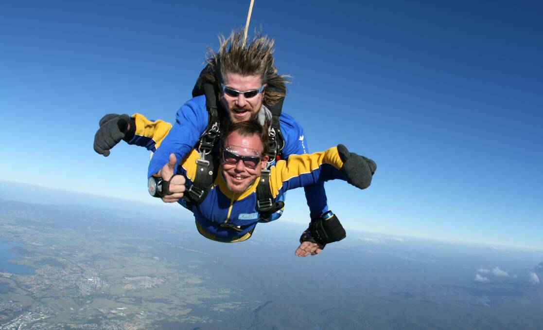 Home grown: Kirk Pengilly, of INXS with Skydive the Beach instructor Alan Moss. Picture: COURTESY OF SKYDIVE