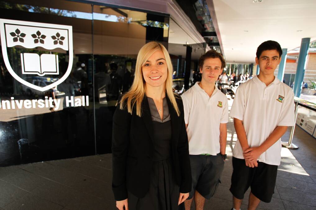 Big Day In: University of Wollongong graduate Veronica O'Gorman with Matt Thompson (centre) and Erick De Los Rayes during the university's career day on Thursday. Picture: CHRISTOPHER CHAN