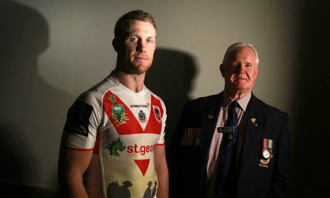 Ben Creagh, with RSL Sub-branch member Joe Davidson, wears the Anzac Day strip. Picture: SYLVIA LIBER