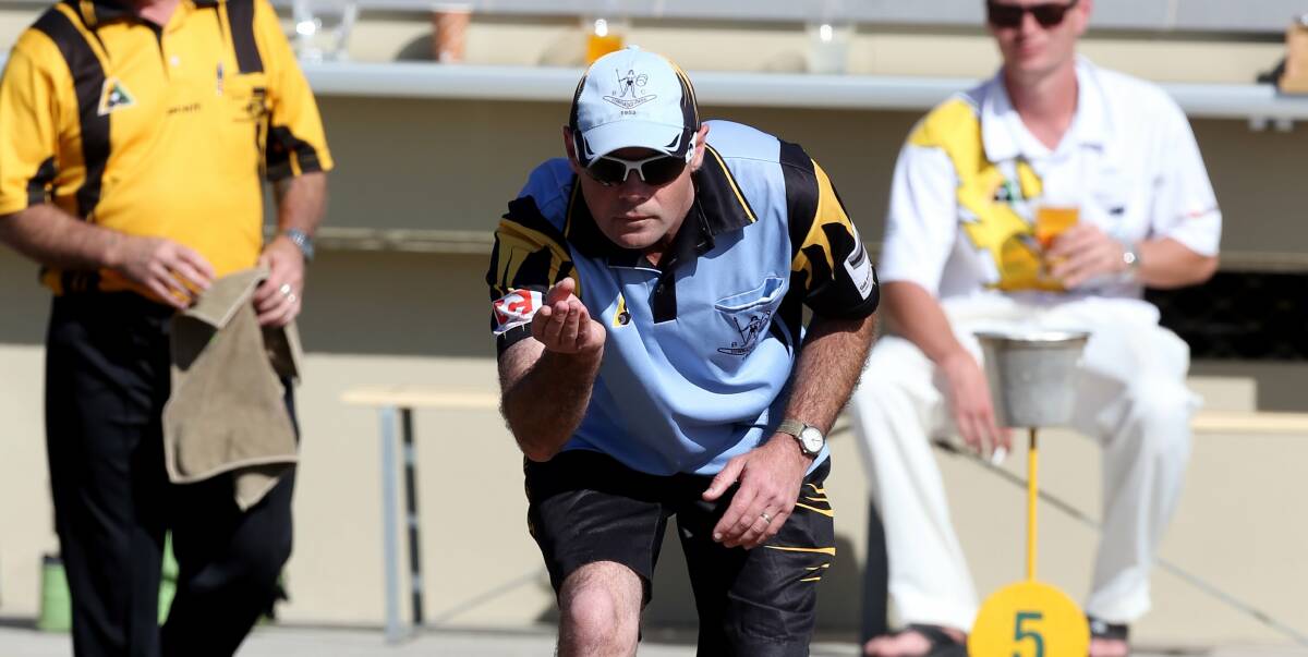 A determined Wes Falconer during his victory for Towradgi in the final of the Champion of Club Champion Singles at Figtree RSL Bowling Club. Picture: ROBERT PEET
