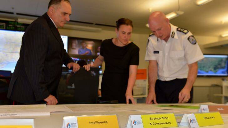 Joe Buffone, with the then emergency services minister, Jane Garrett, and Emergency Management Commissioner Craig Lapsley at the state control centre in October last year. Photo: Joe Armao