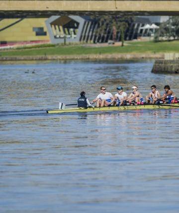 The 44th Disher Cup Regatta: The final race of the day, with the Australian National University Boat club's men's coxed eight in the lead. Photo: Jamila Toderas