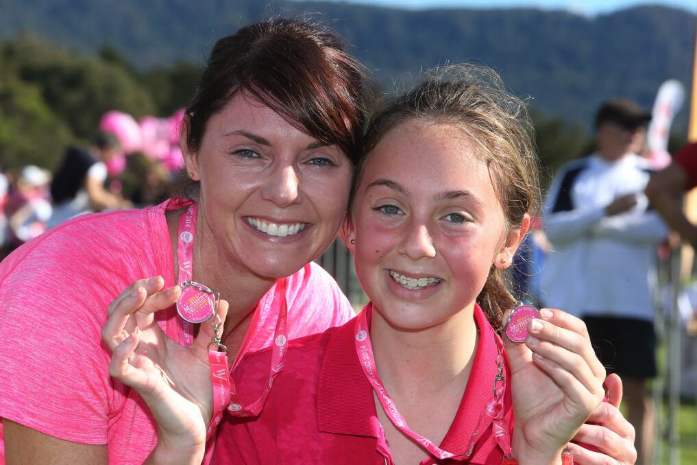 Jakki Agostino with her daughter, Grace, 12, after running the Mother's Day Classic at Stuart Park. Picture: ROBERT PEET