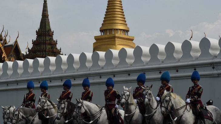 Palace guards outside the Grand Palace in Bangkok waiting for the body of Thailand's King Bhumibol Adulyadej on Friday. Photo: Kate Geraghty