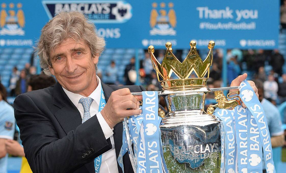 Manchester City manager Manuel Pellegrini celebrates with the EPL trophy. Picture: REUTERS