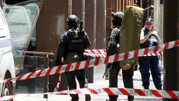 Police snipers enter Martin Place from Macquarie Street as the siege unfolded. Photo: Edwina Pickles