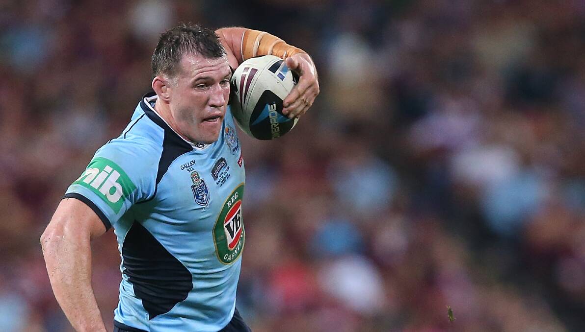 Blues skipper Paul Gallen breaks the defence of Queensland's Nate Myles in Origin 1 on May 28, at Suncorp Stadium in Brisbane. Picture: GETTY IMAGES