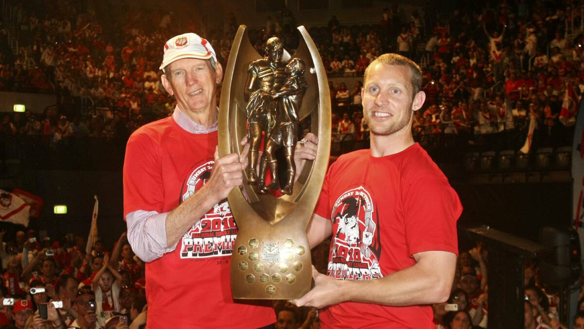 Former St George Illawarra coach Wayne Bennett and skipper Ben Hornby with the NRL trophy the club won in October 2010. 