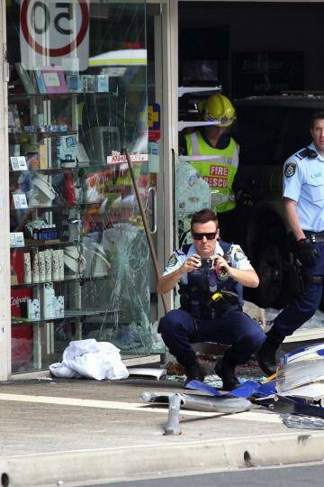 A car ploughed through a bus stop outside a Kogarah chemist on Monday in the second such incident in the same spot. Photo: Ben Rushton/ Getty Images