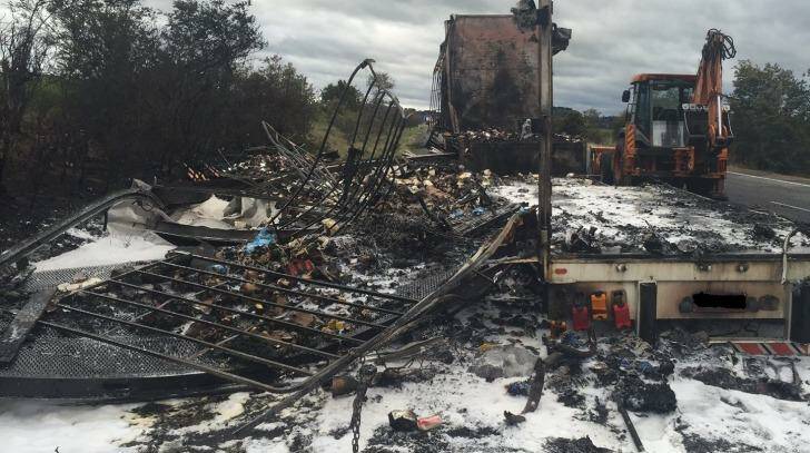 A truck was destroyed by fire on the Hume Highway south of Sutton Forest on Monday. Photo: Live Traffic NSW