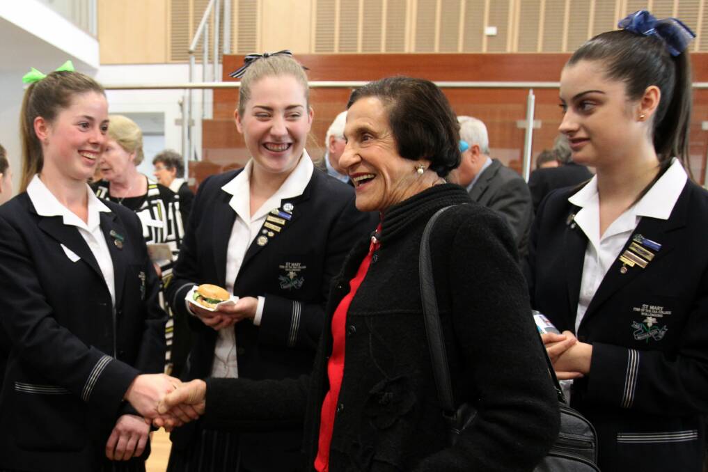 Bashir house students Mikayla Lilli, Katelin Koprivec and Alexia Mihalopoulos meet Dame Marie Bashir at the opening. Picture: GREG TOTMAN