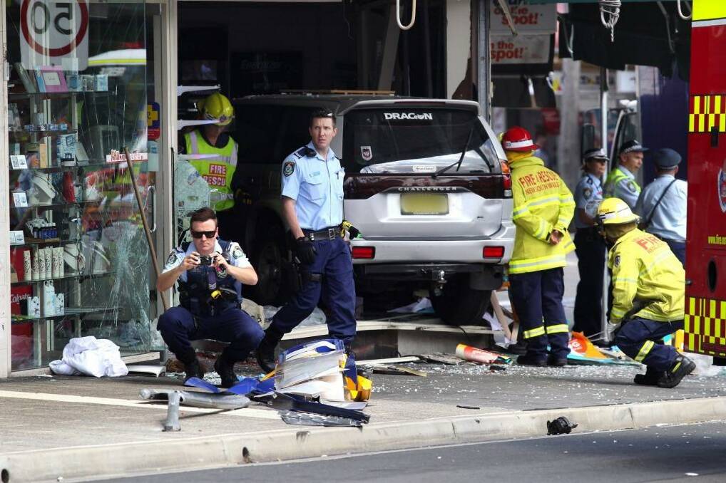 A car ploughed through a bus stop outside a Kogarah chemist on Monday in the second such incident in the same spot. Photo: Ben Rushton/ Getty Images
