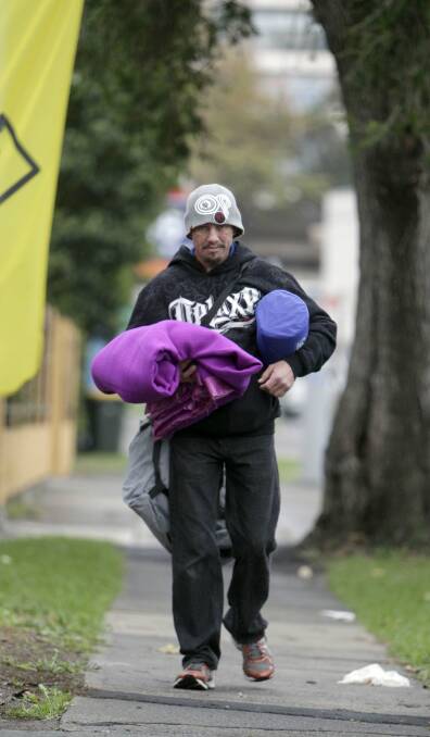 Drenched: "Davo", who has been sleeping rough, has been helped by the Wollongong Homeless Hub after a massive influx of requests for assistance during the stormy weather.Picture: ANDY ZAKELI