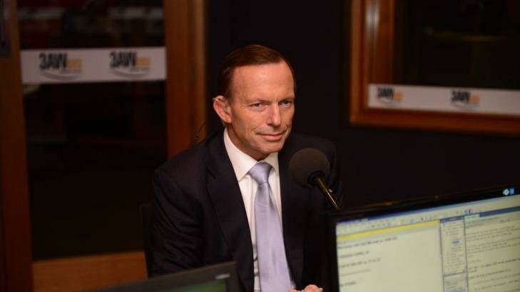 Tough sell: Prime Minister Tony Abbott speaking to Neil Mitchell on Fairfax radio in Melbourne. Photo: Penny Stephens