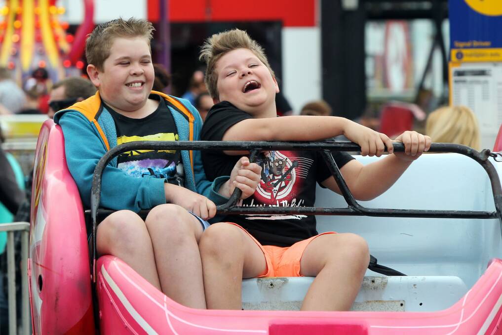 Jjack and Kye Williams enjoy a ride at Dapto Street Fair. Picture: SYLVIA LIBER
