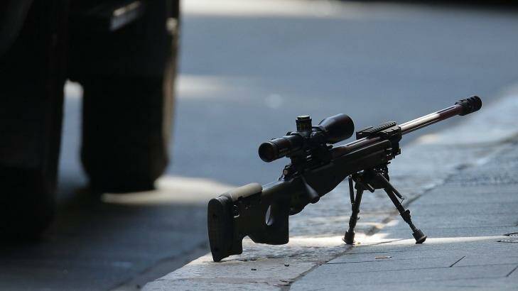 A sniper's rifle on the ground in Phillip Street during the Lindt cafe siege.  Photo: Mark Metcalfe/Getty Images