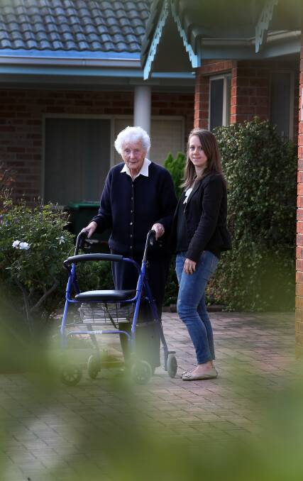 Assistance: University of Wollongong researcher Eliza de Vet with Warrigal resident Jean O'Connor. Picture: ROBERT PEET