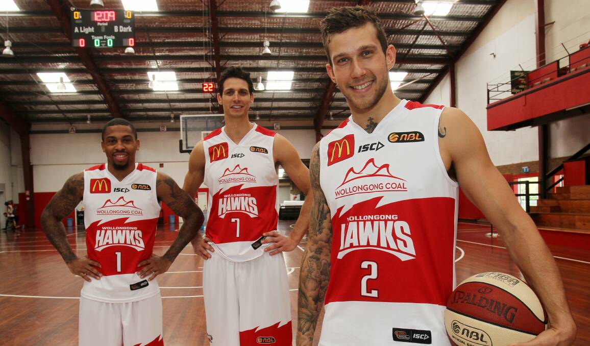 Gary Ervin, Oscar Forman and Tyson Demos show off the new Hawks playing strip. Picture: GREG TOTMAN