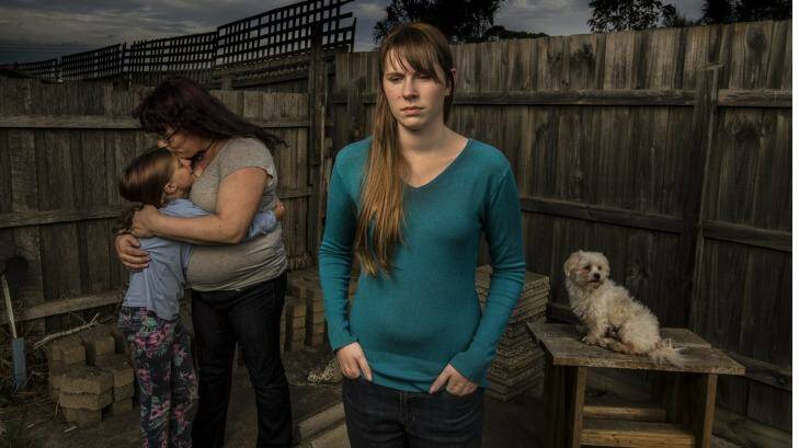Bernadette, (left, with a family member) and her daughter Thalia (centre), who have both had to relocate. Photo: Simon O'Dwyer
