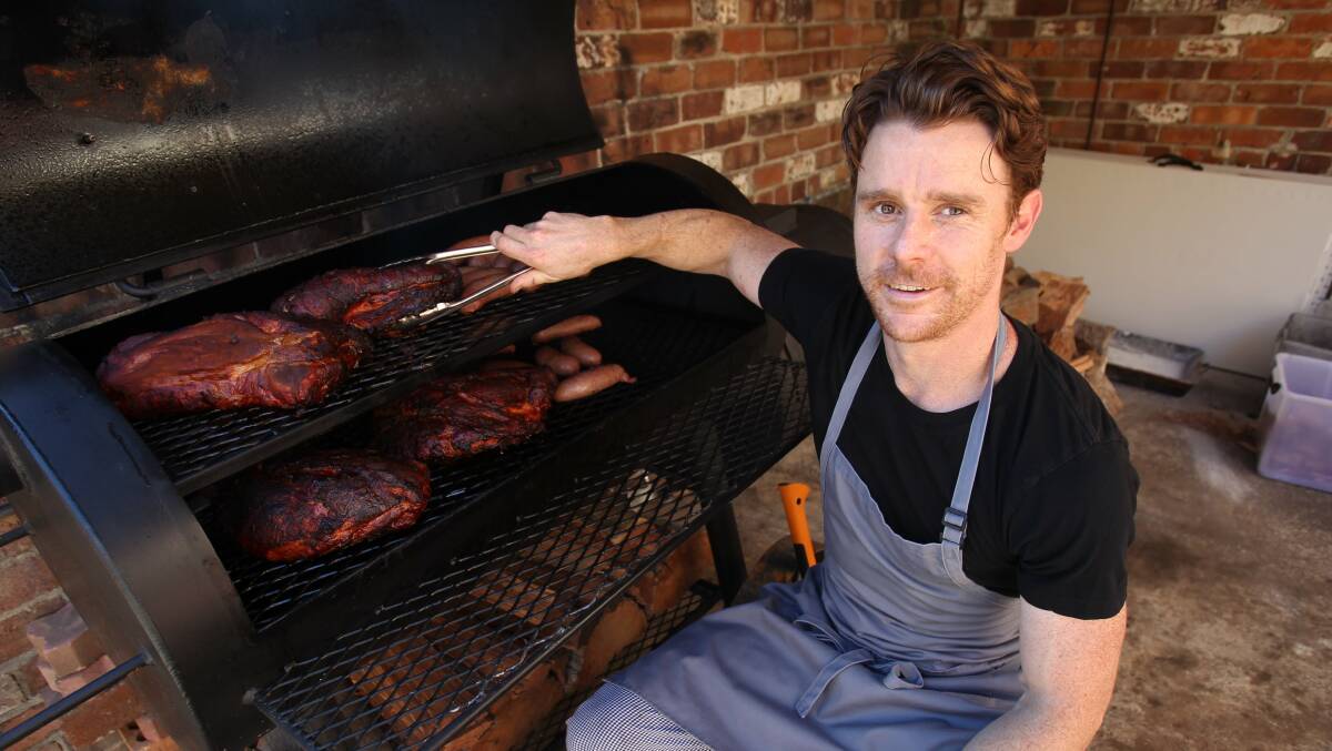 Chef Andy Burns is smoking up a storm with his 300 kilogram smoker. Picture: GREG TOTMAN