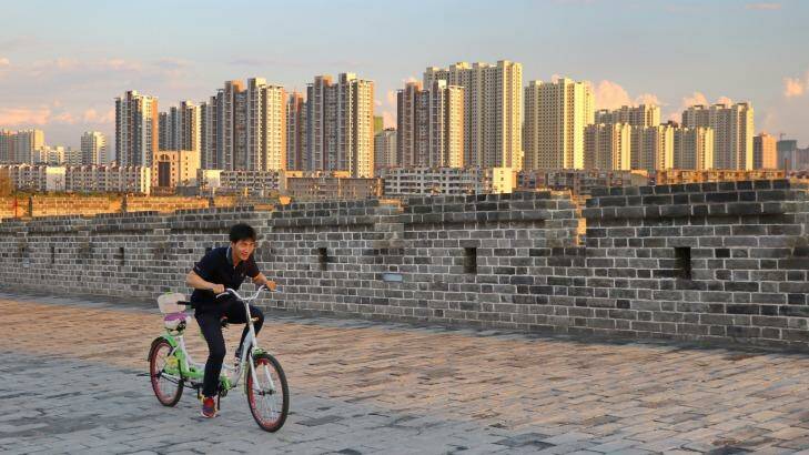 Locals enjoy cycling on Datong's replica ''ancient'' city wall, a legacy of mayor Geng Yanbo. Photo: Sanghee Liu